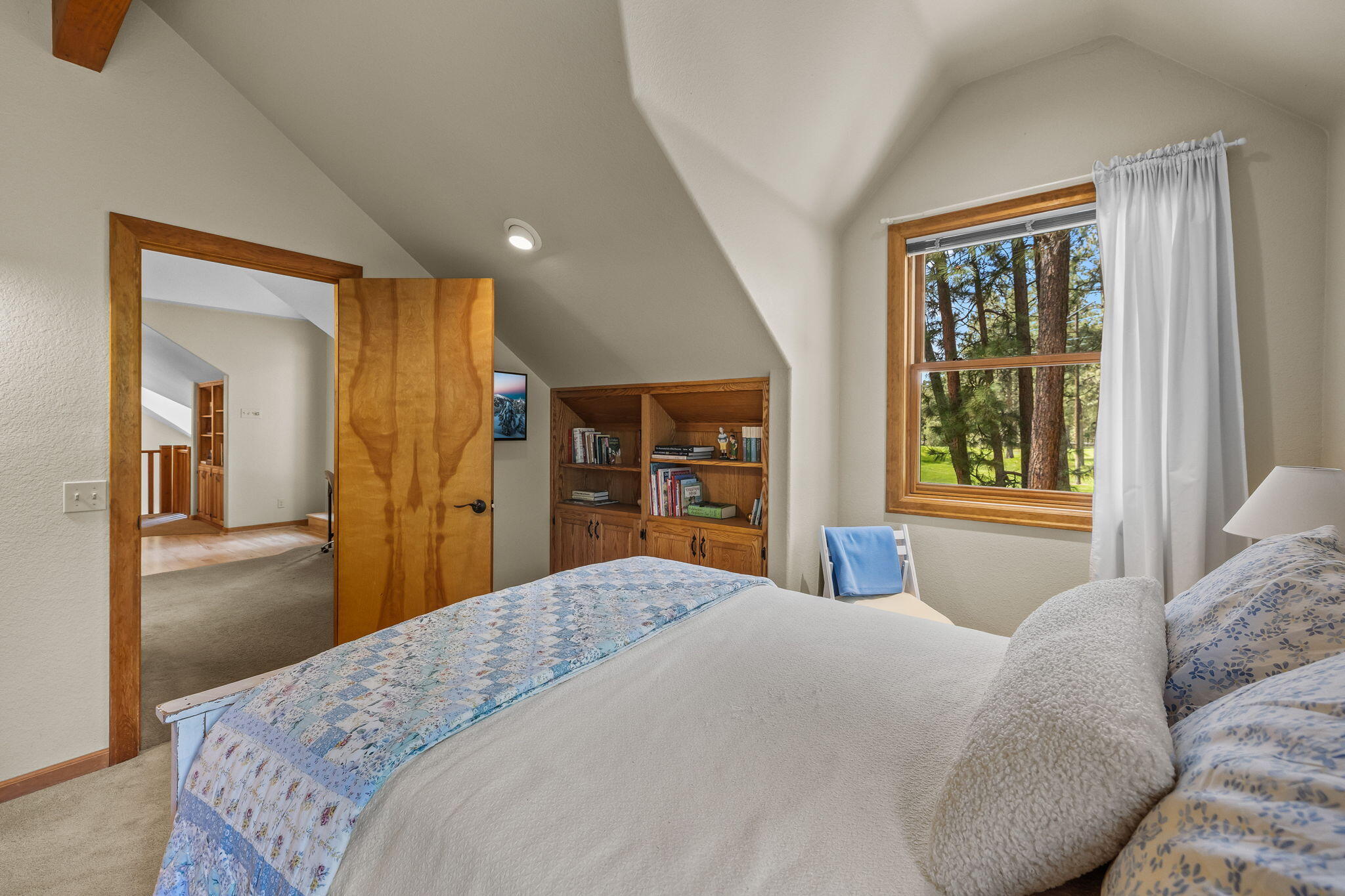 60779 Currant Way Bend, OR 97702 - Photo 33 of 63 a bedroom with a large bed and a window