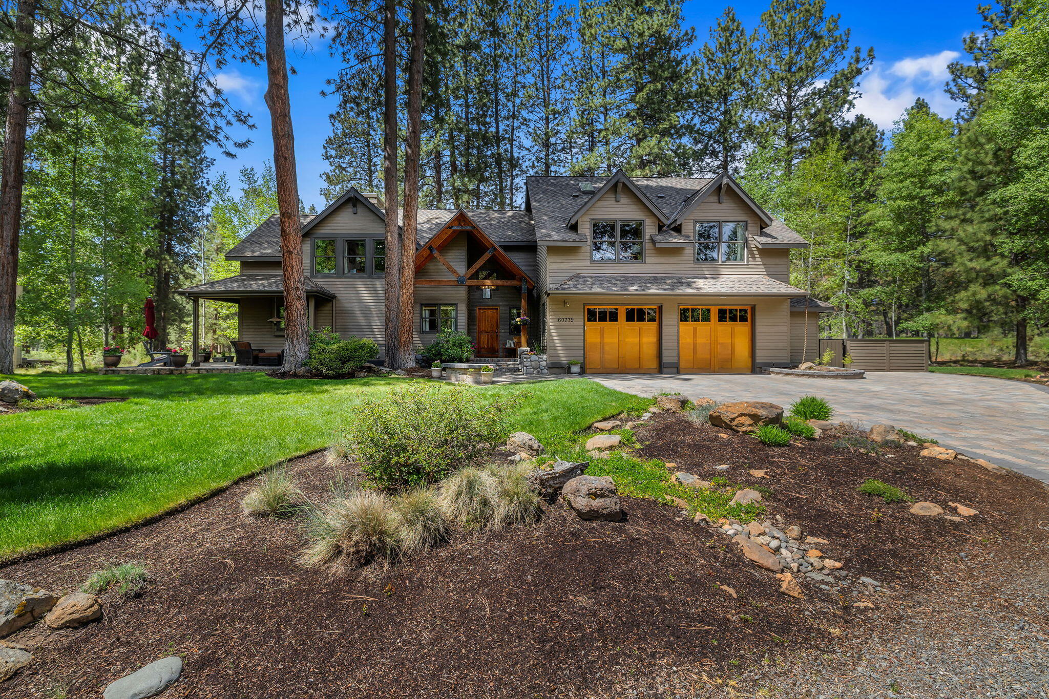 60779 Currant Way Bend, OR 97702 - Photo 4 of 63 a front view of a house with garden
