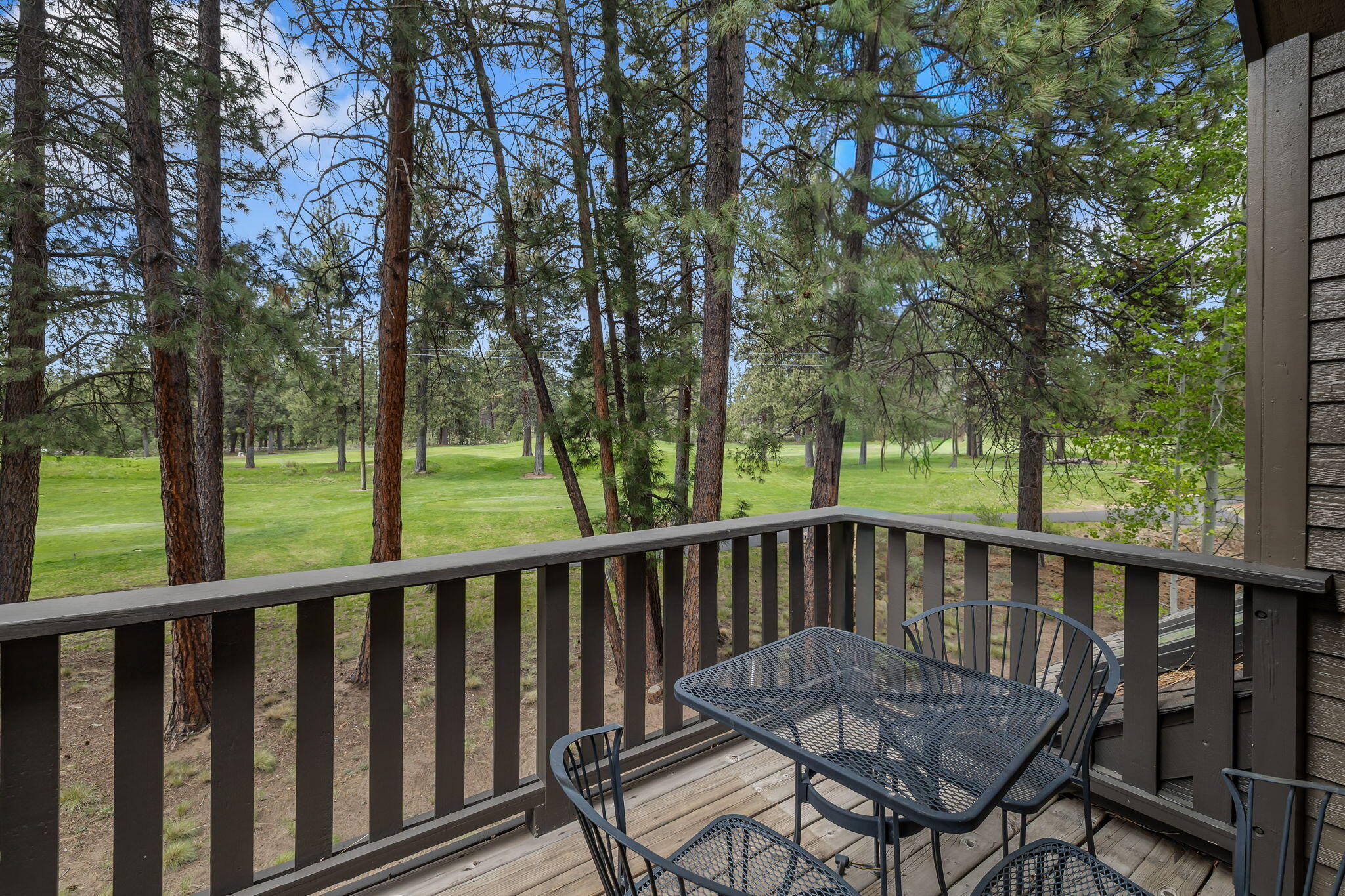 60779 Currant Way Bend, OR 97702 - Photo 61 of 63 a view of a wooden chairs and table in the outdoor