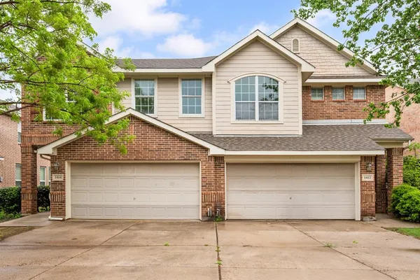 a view of front a house with a garage