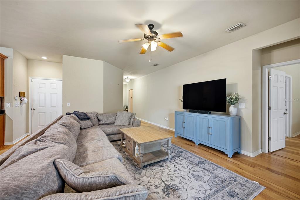 7550 Southwest 81st Way Gainesville, FL 32608 - Photo 7 of 31 a living room with furniture and a flat screen tv