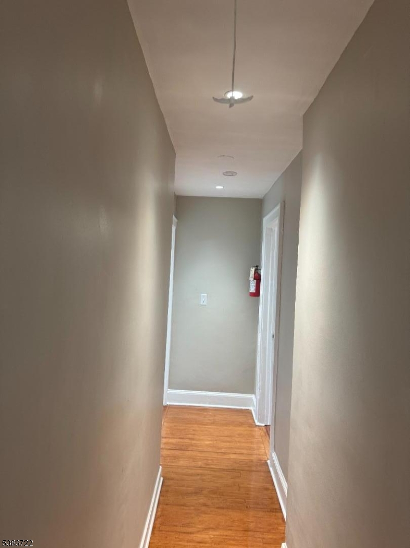 375 Tower Street Union, NJ 07088 - Photo 6 of 11 a view of a hallway with wooden floor and chandelier