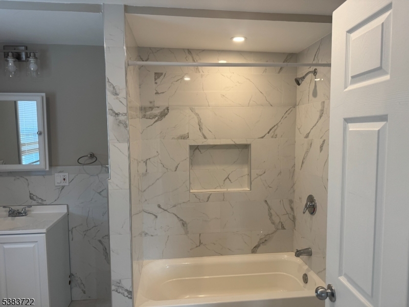 375 Tower Street Union, NJ 07088 - Photo 9 of 11 a bathroom with a shower and a tub