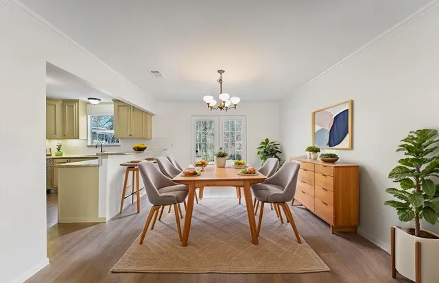 a kitchen with a stove a sink and a microwave
