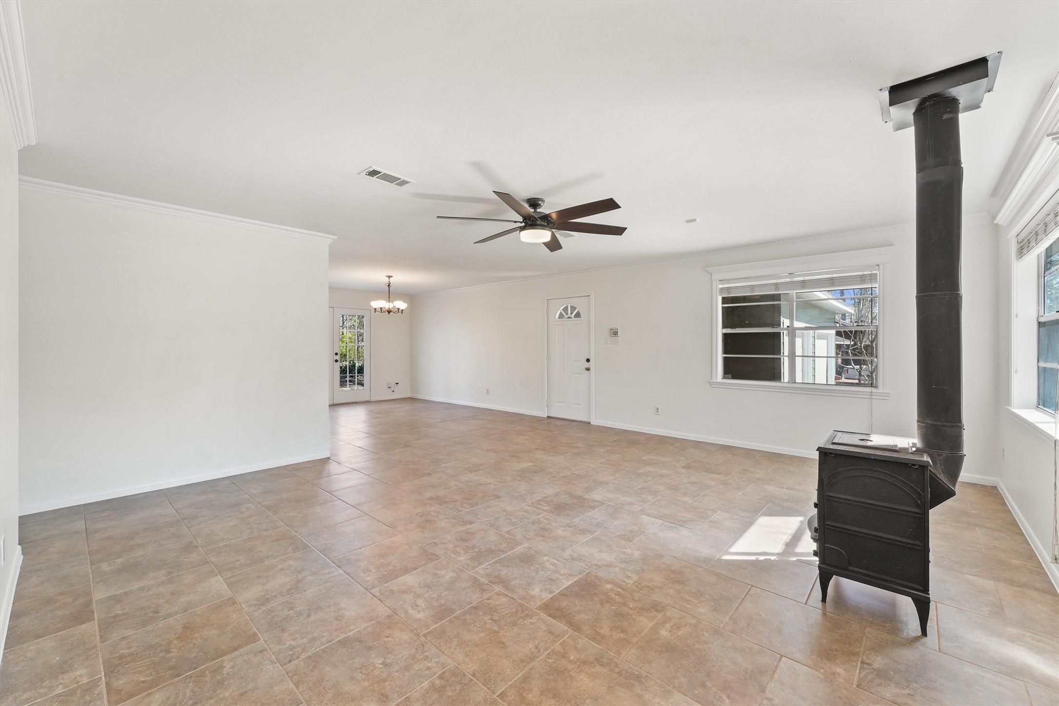 22514 Lakeway Drive Spring, TX 77373 - Photo 7 of 18 a view of a livingroom with a ceiling fan and window
