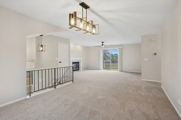 a view of empty room with a fireplace