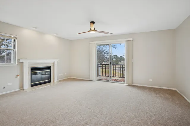 a view of empty room with a fireplace