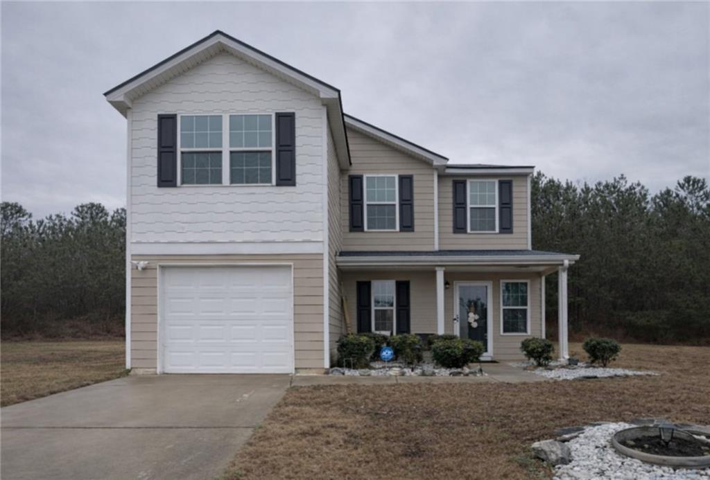 1728 Mary Avenue Griffin, GA 30224 - Photo 1 of 31 a front view of a house with a yard and garage