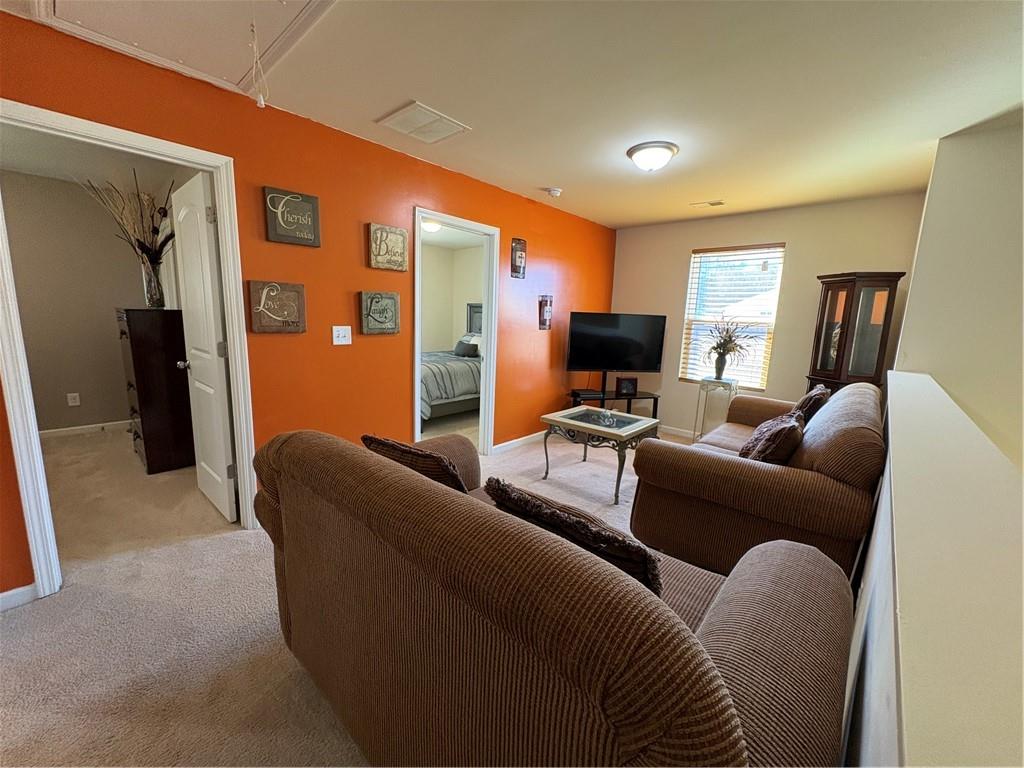 1728 Mary Avenue Griffin, GA 30224 - Photo 17 of 31 a living room with furniture and a flat screen tv