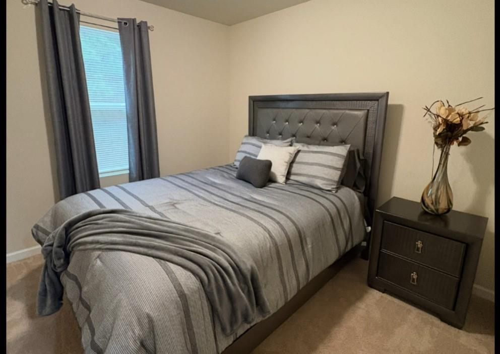 1728 Mary Avenue Griffin, GA 30224 - Photo 18 of 31 a bedroom with a bed and a mirror