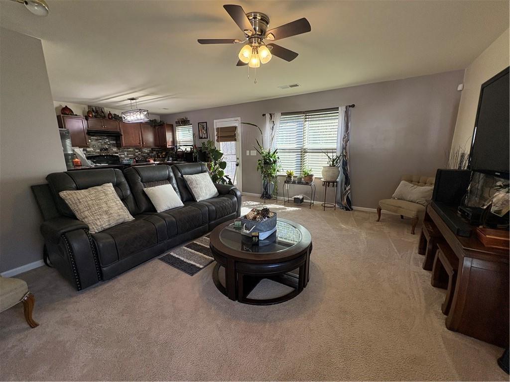 1728 Mary Avenue Griffin, GA 30224 - Photo 2 of 31 a living room with furniture and a flat screen tv