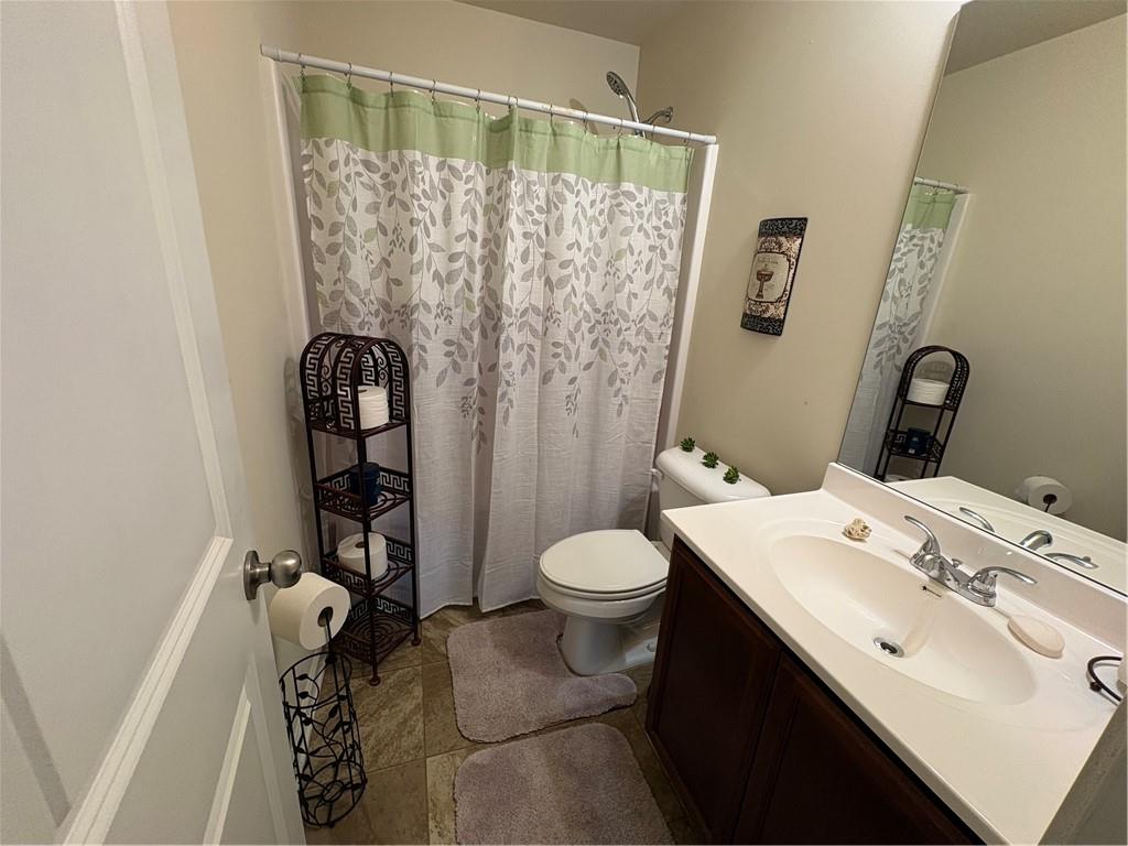 1728 Mary Avenue Griffin, GA 30224 - Photo 21 of 31 a bathroom with a sink toilet and shower