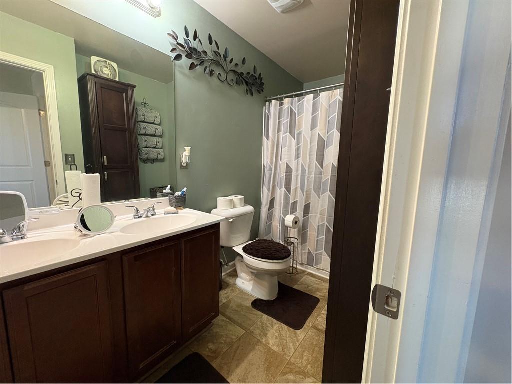1728 Mary Avenue Griffin, GA 30224 - Photo 25 of 31 a bathroom with a sink and a mirror
