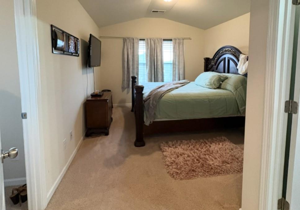 1728 Mary Avenue Griffin, GA 30224 - Photo 26 of 31 a bedroom with a bed and mirror