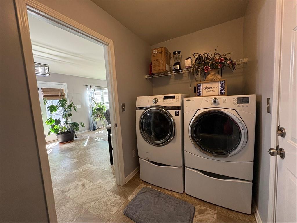 1728 Mary Avenue Griffin, GA 30224 - Photo 7 of 31 a view of a hallway with washer and dryer