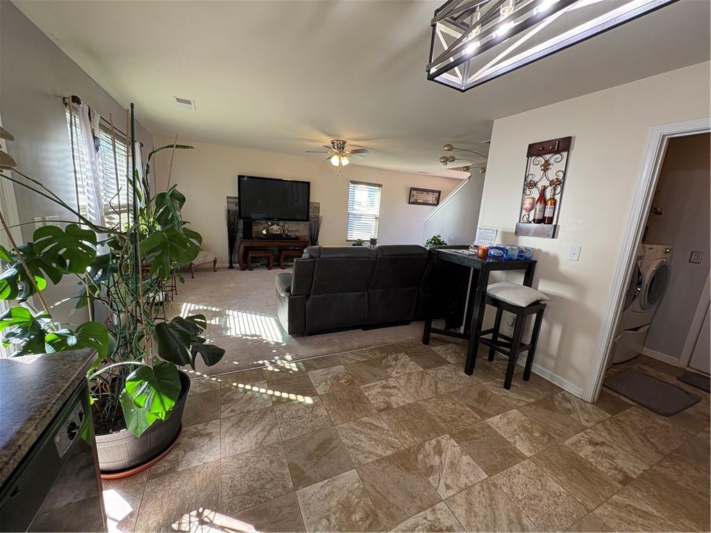 1728 Mary Avenue Griffin, GA 30224 - Photo 8 of 31 a living room with furniture gym equipment and a flat screen tv