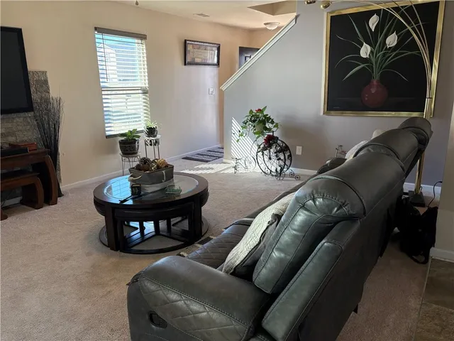 a bedroom with a bed and mirror