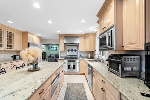 a kitchen with a sink stove and refrigerator