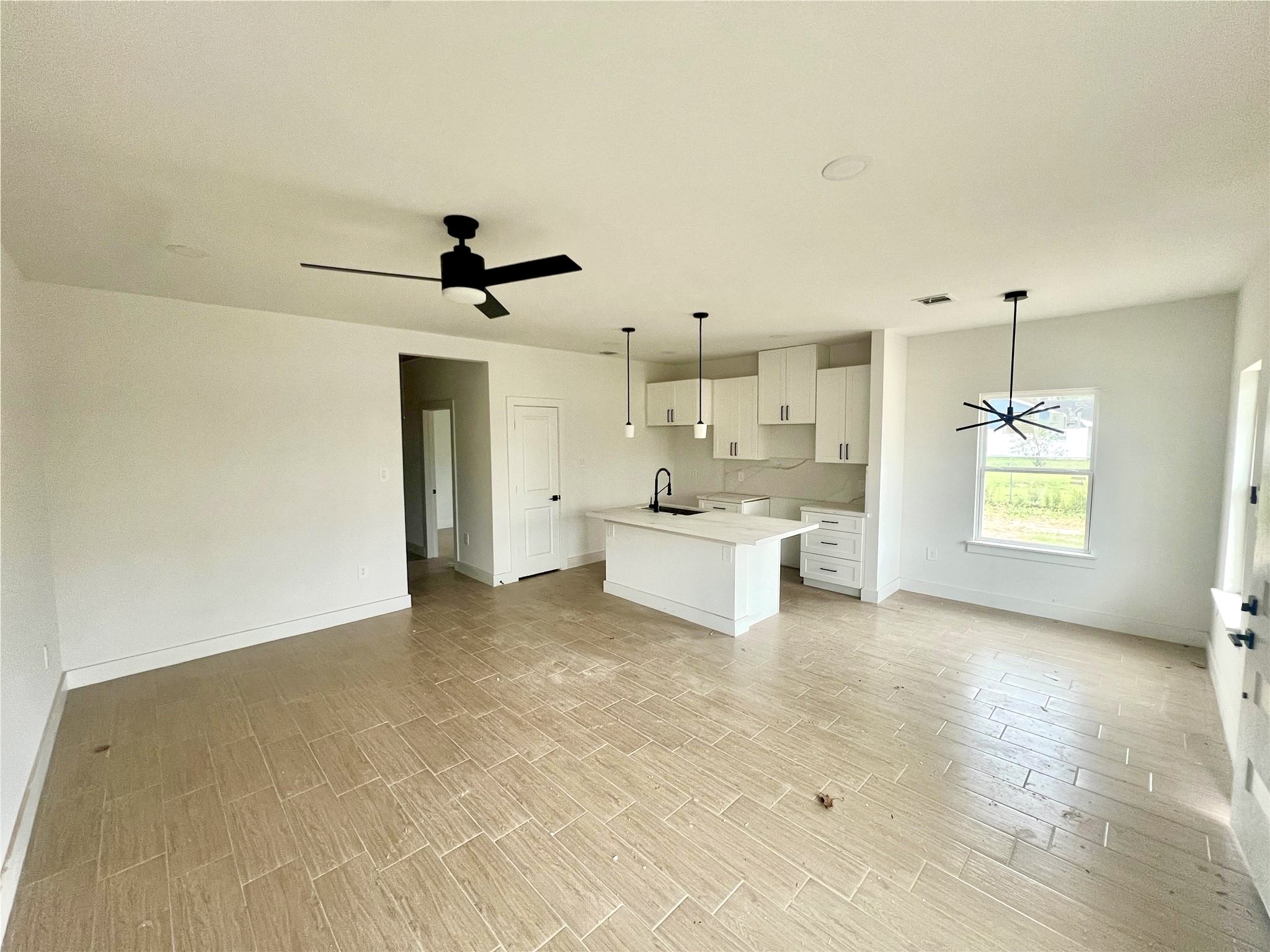 5710 Delmack Street, Unit A Houston, TX 77032 - Photo 5 of 23 Living Room, Kitchen, & Dinning