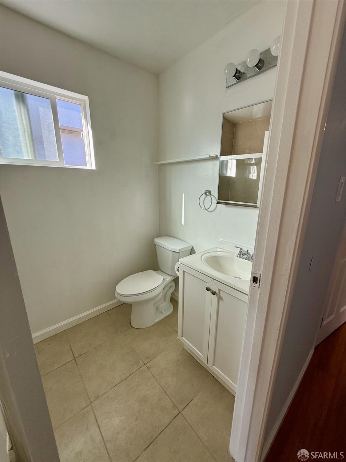 45 Spruce Street Millbrae, CA 94030 - Photo 10 of 17 a bathroom with a sink a toilet and shower