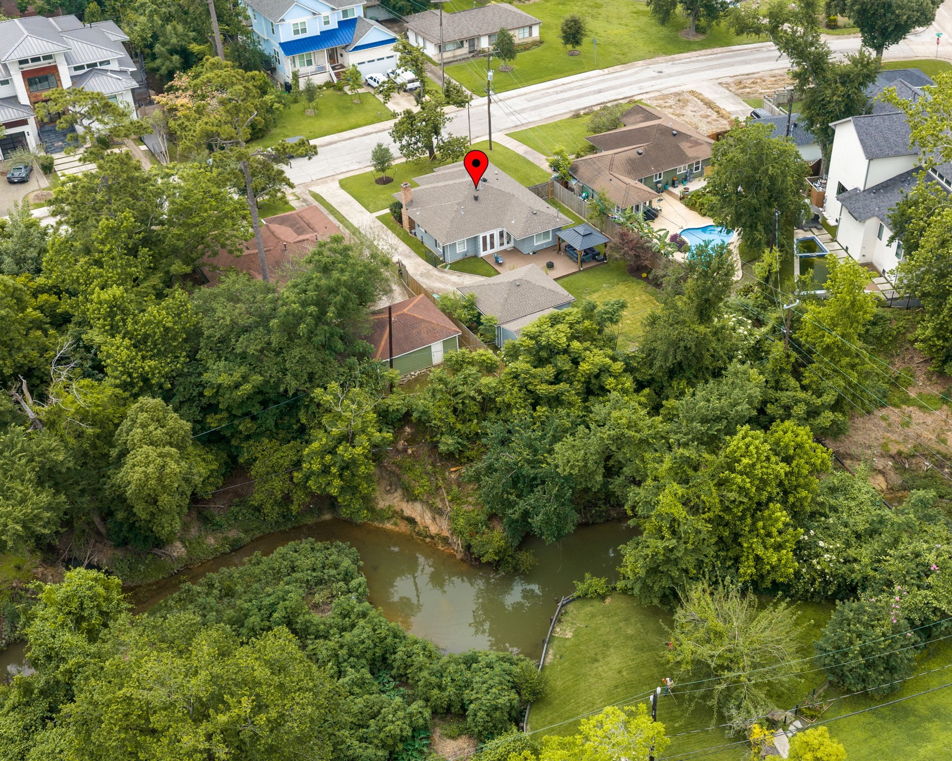 1115 Woodhill Road Houston, TX 77008 - Photo 21 of 29 One of the largest lots available. Property goes to the middle of Turkey Gulch. Trees can be cleared to make additional outdoor spaces down to the clear running water creek.