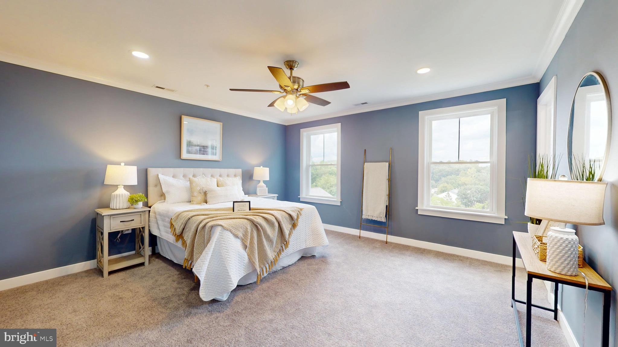 6516 Golden Ring Road Rosedale, MD 21237 - Photo 12 of 32 a spacious bedroom with a bed and a table in it with window