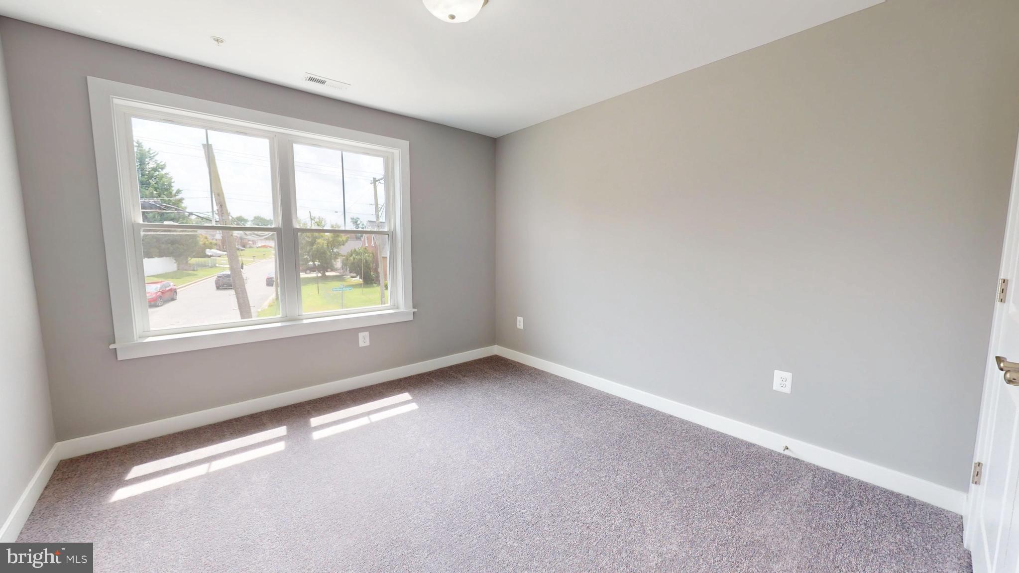 6516 Golden Ring Road Rosedale, MD 21237 - Photo 16 of 32 an empty room with a window