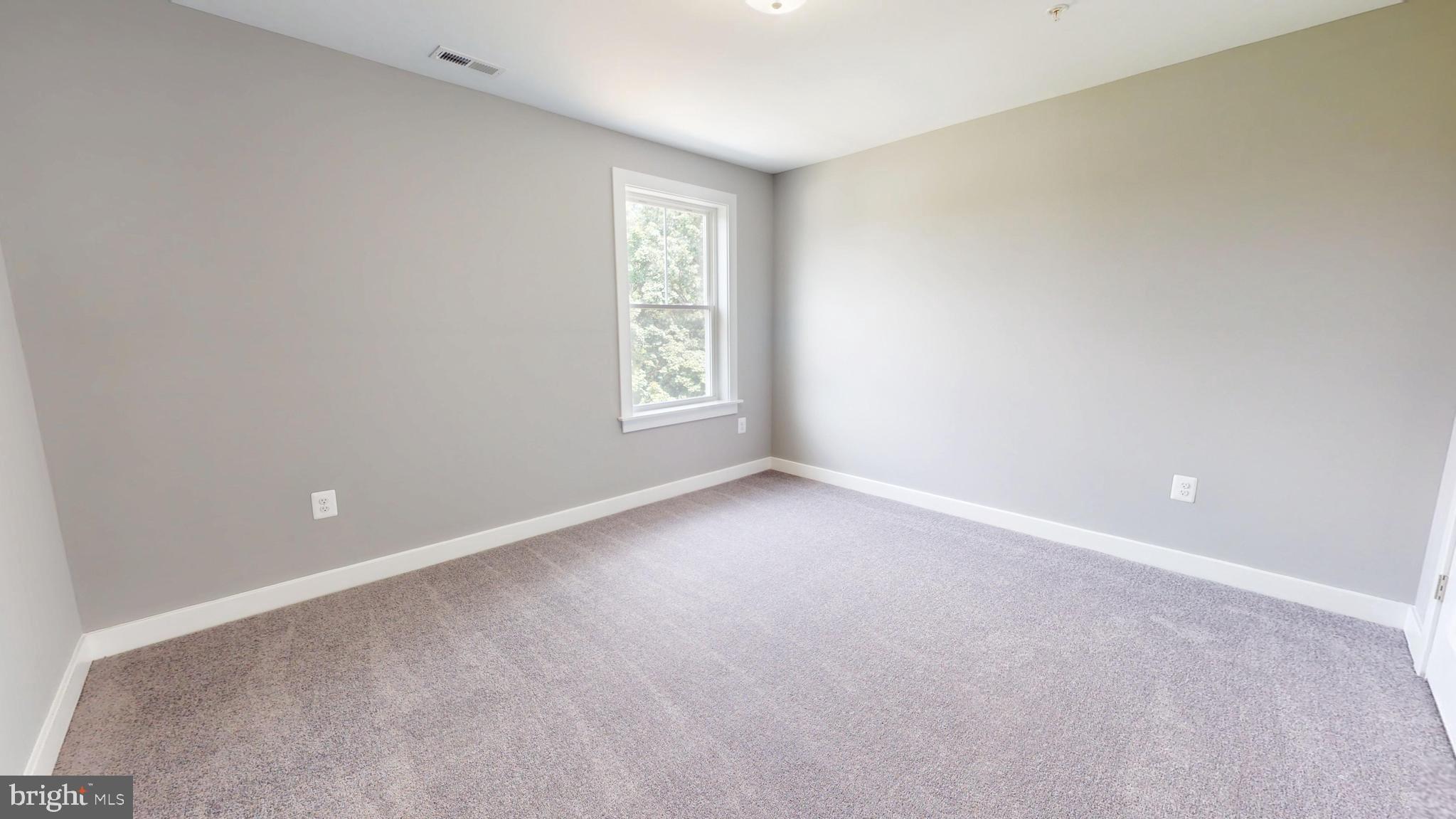 6516 Golden Ring Road Rosedale, MD 21237 - Photo 19 of 32 a view of an empty room with a window