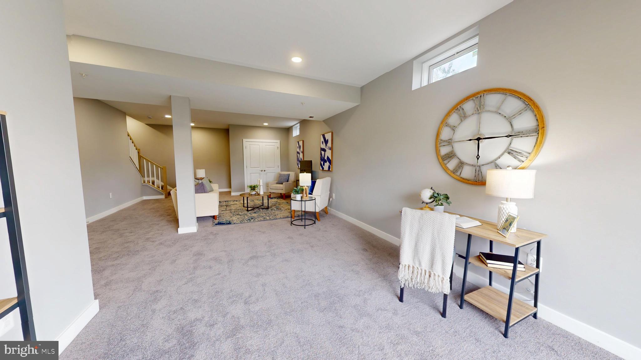 6516 Golden Ring Road Rosedale, MD 21237 - Photo 26 of 32 a view of a livingroom with furniture and a mirror