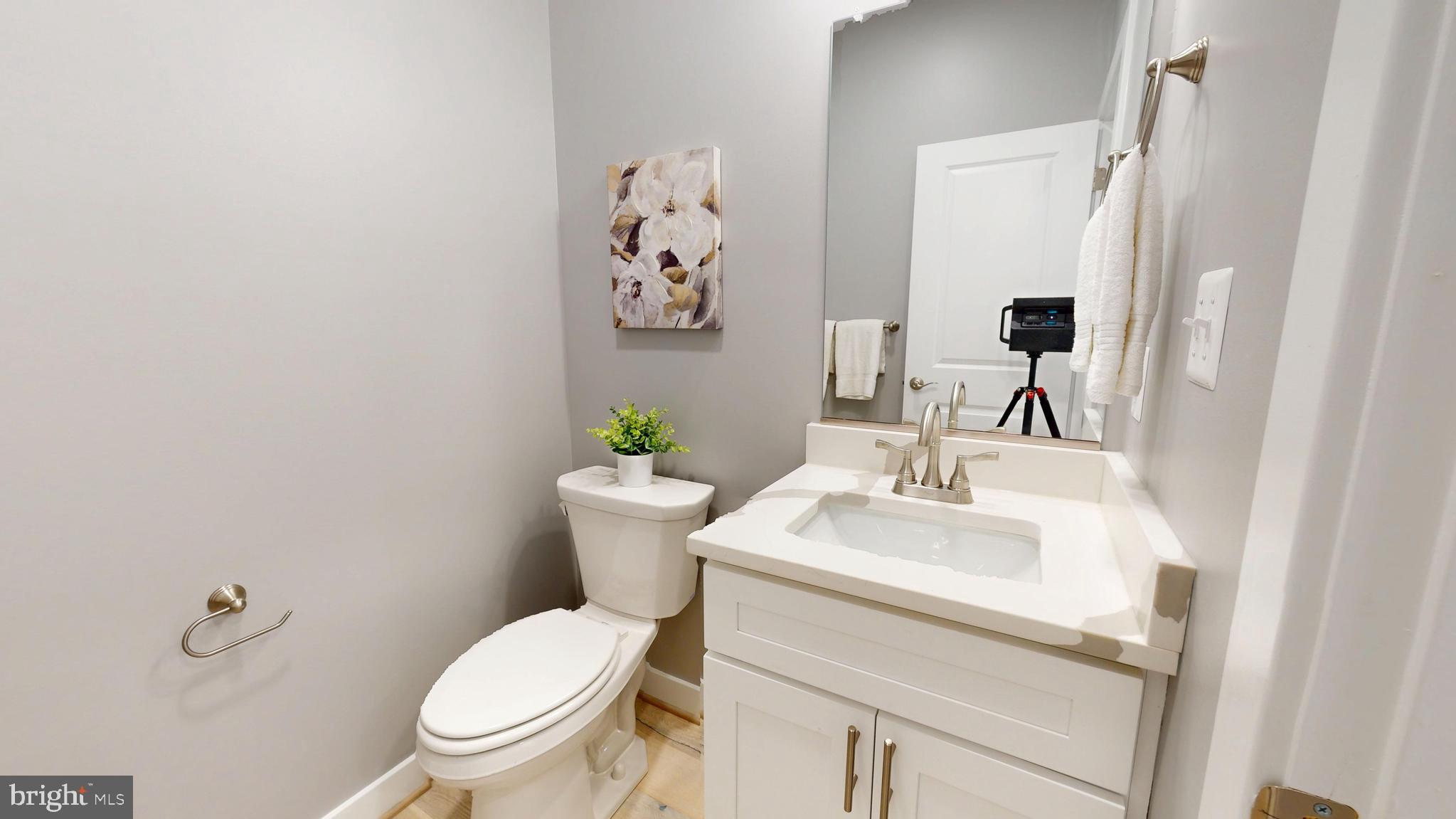 6516 Golden Ring Road Rosedale, MD 21237 - Photo 5 of 32 a white toilet sitting next to a bathroom sink