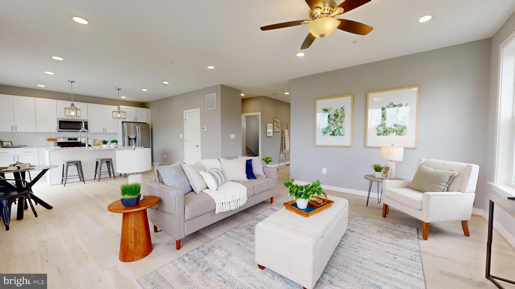 6516 Golden Ring Road Rosedale, MD 21237 - Photo 7 of 32 a living room with furniture and kitchen view