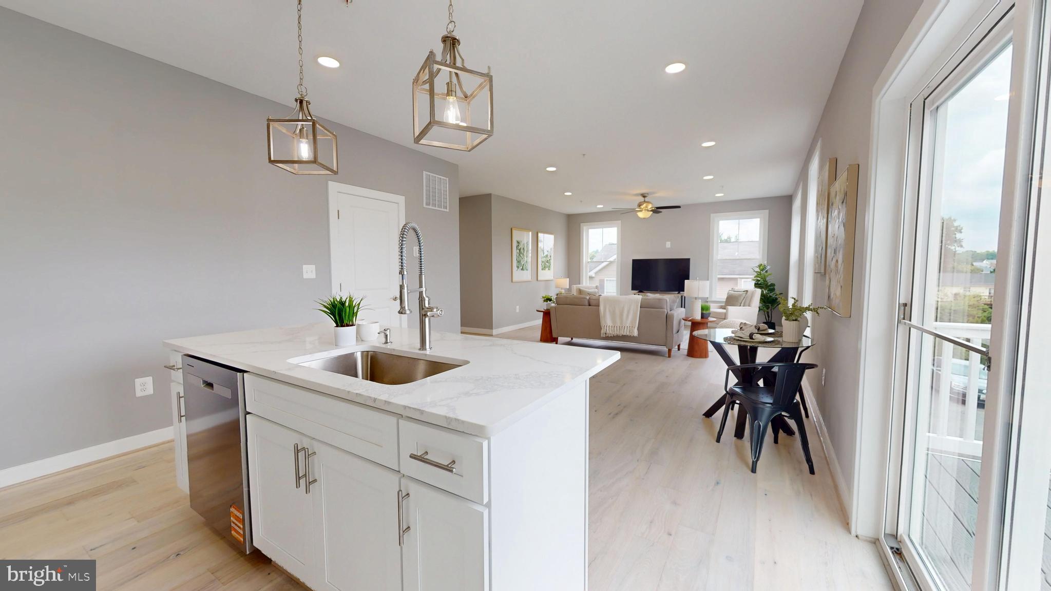 6516 Golden Ring Road Rosedale, MD 21237 - Photo 10 of 32 a view of a kitchen and living room