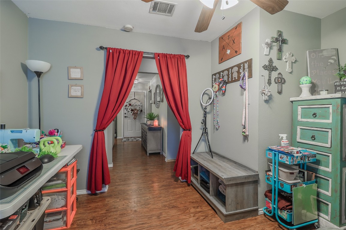 1705 Friars Tale Lane Austin, TX 78748 - Photo 17 of 29 a living room with furniture and a wooden floor