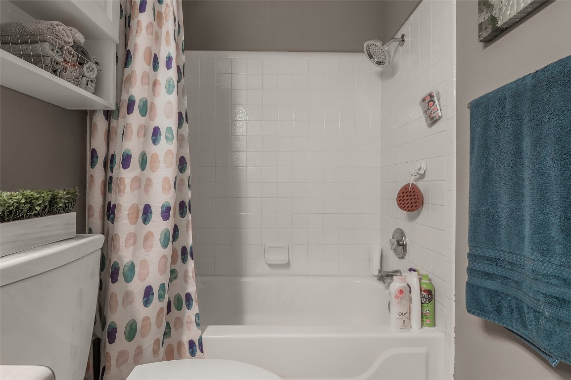 1705 Friars Tale Lane Austin, TX 78748 - Photo 21 of 29 a bathroom with a bathtub and shower