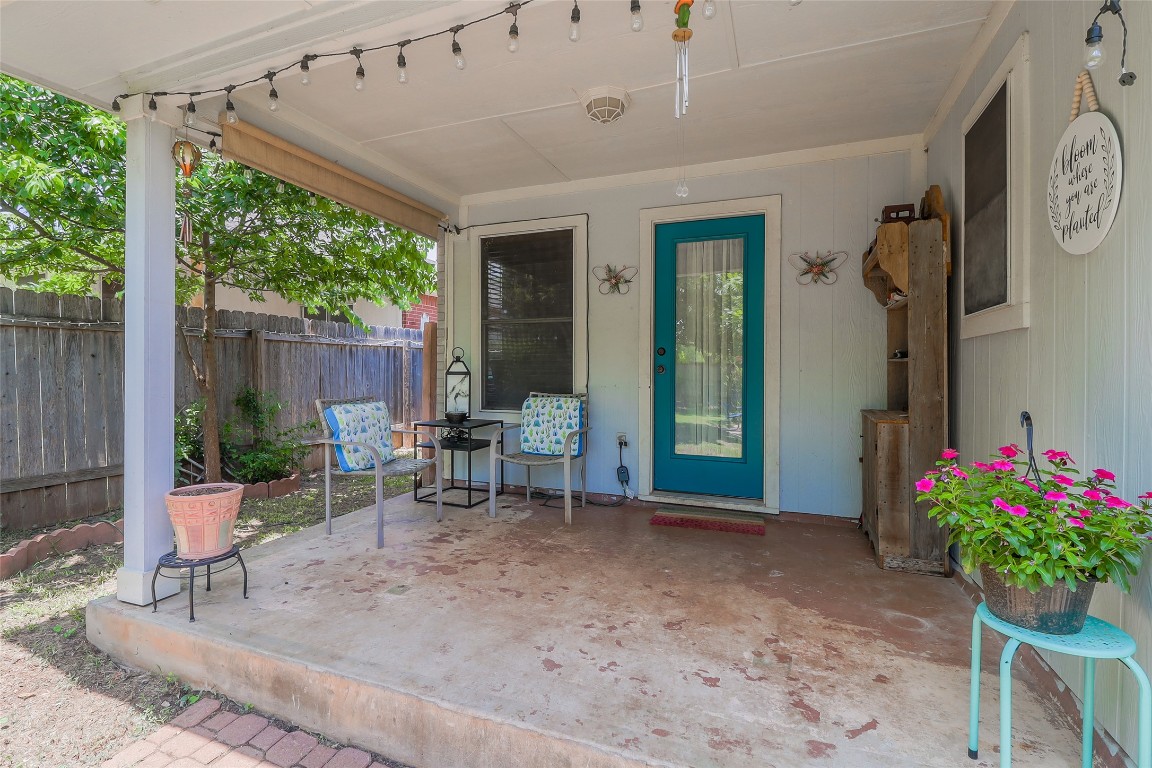 1705 Friars Tale Lane Austin, TX 78748 - Photo 25 of 29 a view of a patio with a table and chairs potted plants