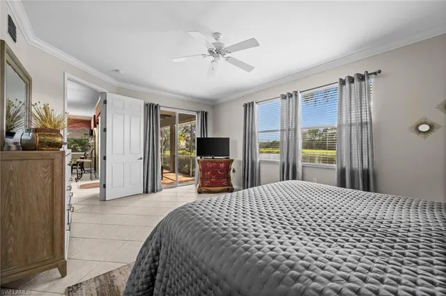 a large bedroom with a bed and a large mirror