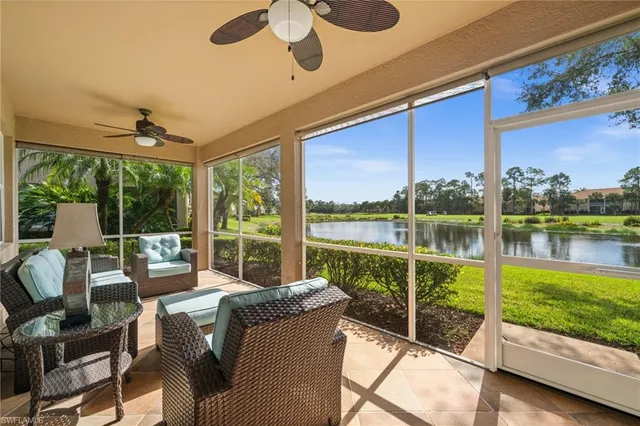 a living room with hardwood floor and balcony