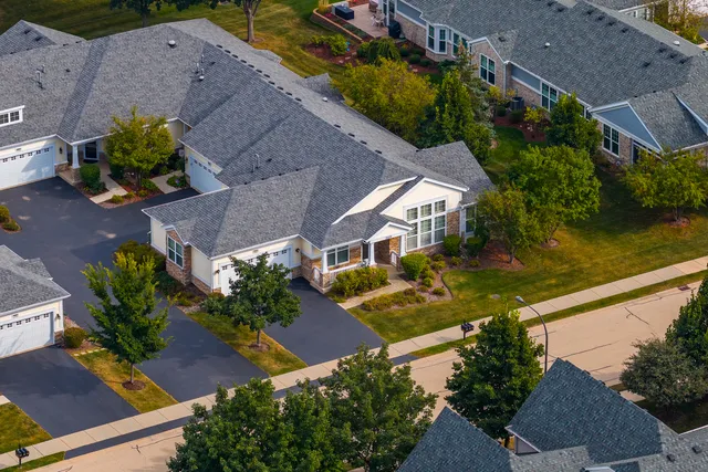 an aerial view of house with yard