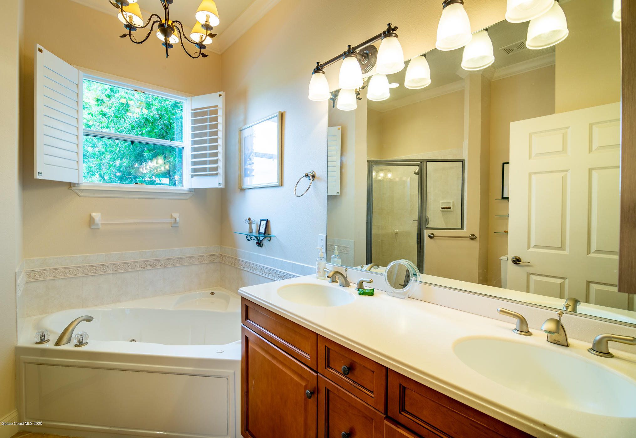 4070 Alamanda Key Drive Melbourne, FL 32901 - Photo 14 of 32 a bathroom with a sink and a mirror