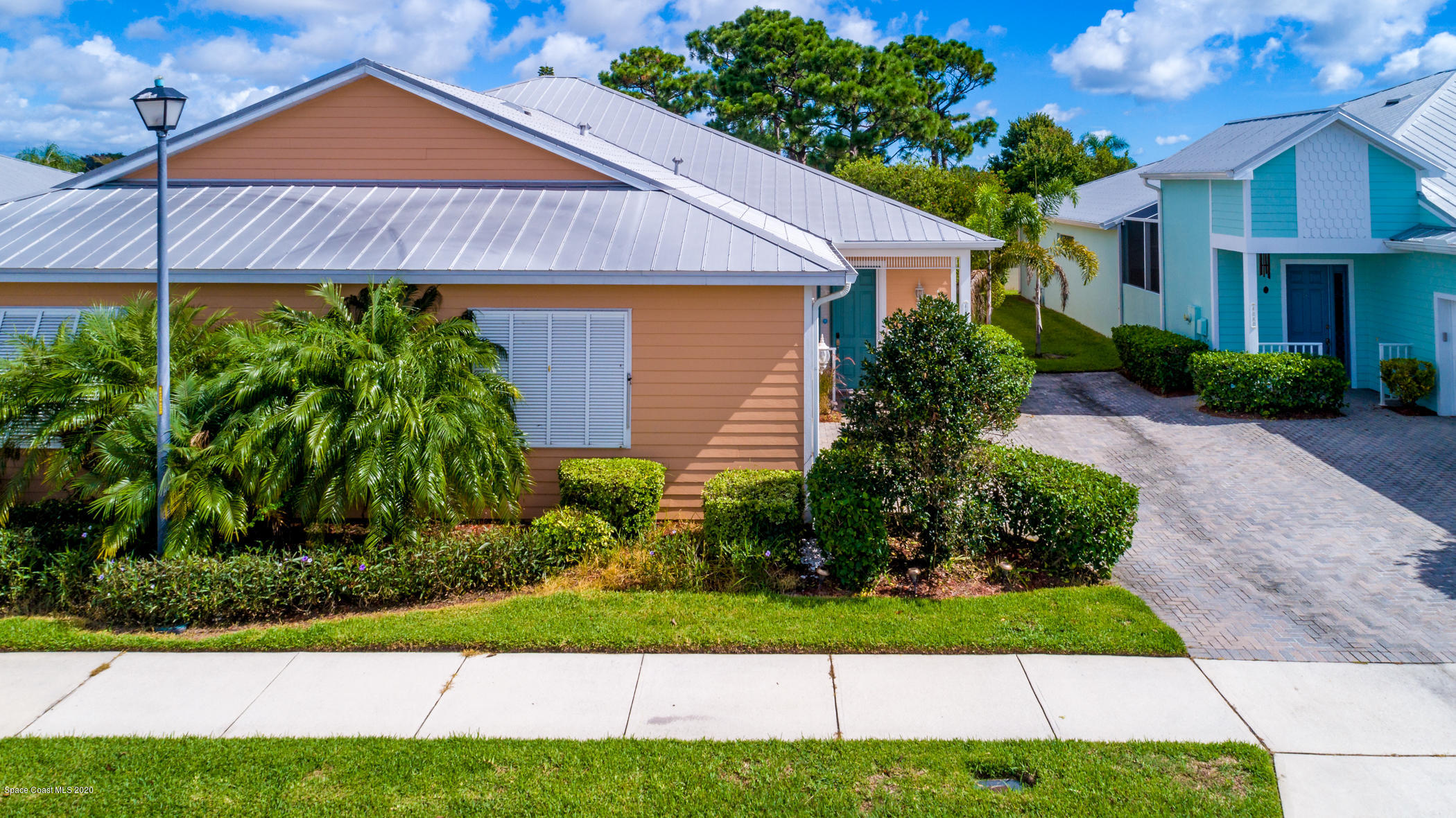 4070 Alamanda Key Drive Melbourne, FL 32901 - Photo 19 of 32 a front view of a house with a yard