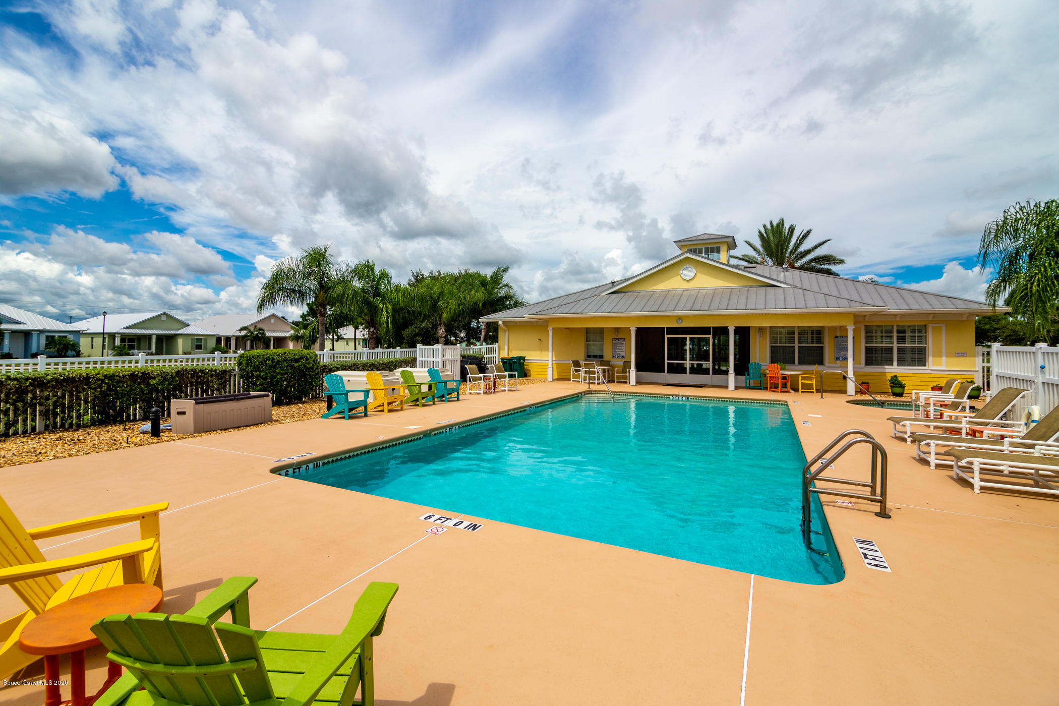 4070 Alamanda Key Drive Melbourne, FL 32901 - Photo 20 of 32 a front view of a house with swimming pool having outdoor seating