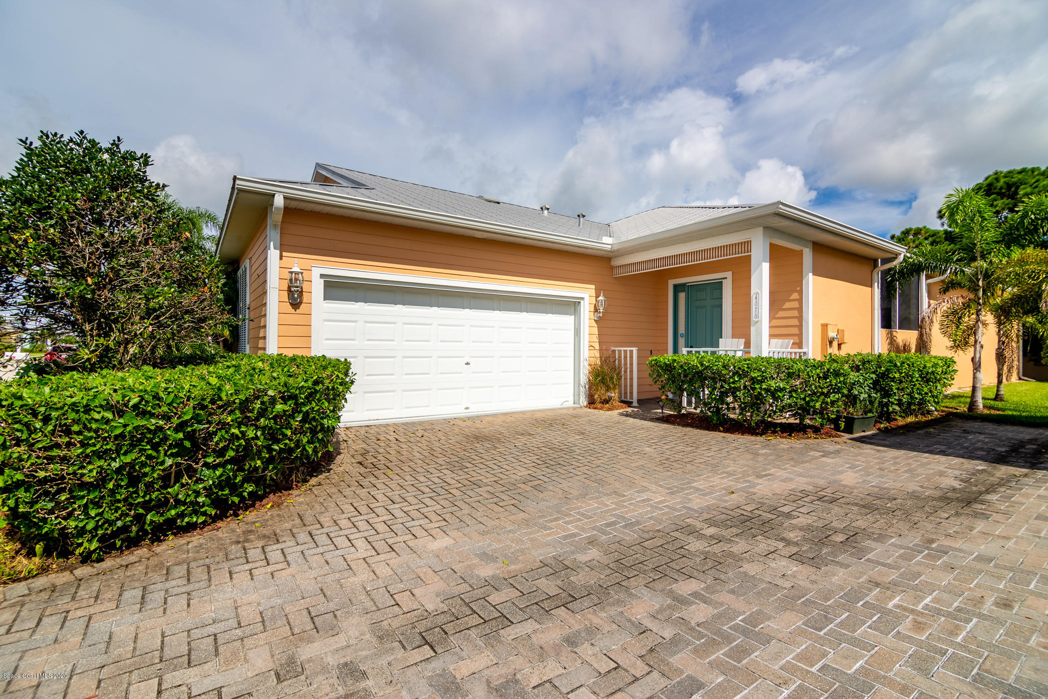 4070 Alamanda Key Drive Melbourne, FL 32901 - Photo 2 of 32 a front view of house with yard and trees around