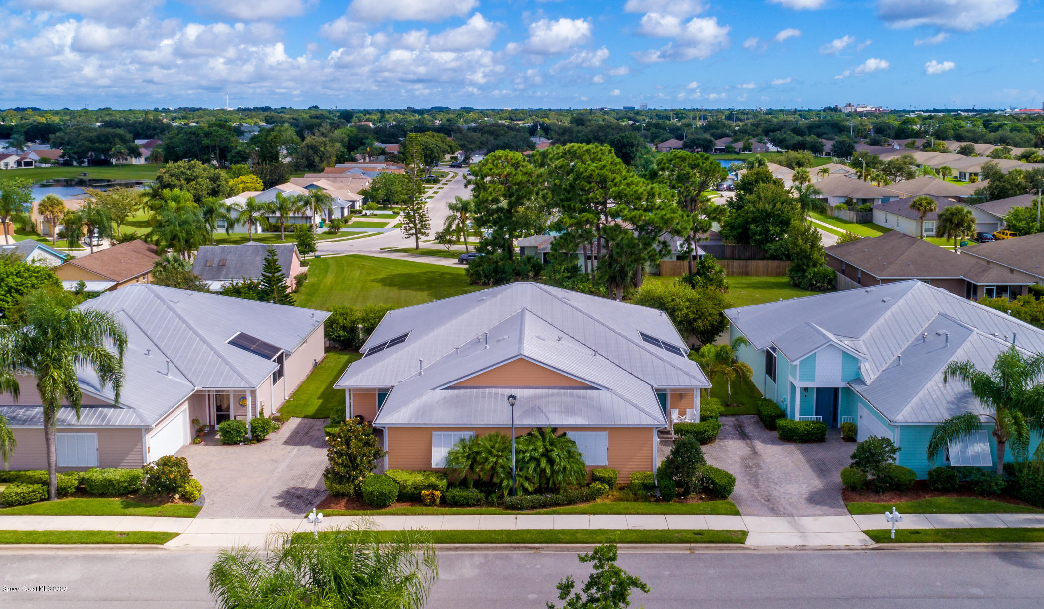 4070 Alamanda Key Drive Melbourne, FL 32901 - Photo 22 of 32 an aerial view of a house with a garden and lake view