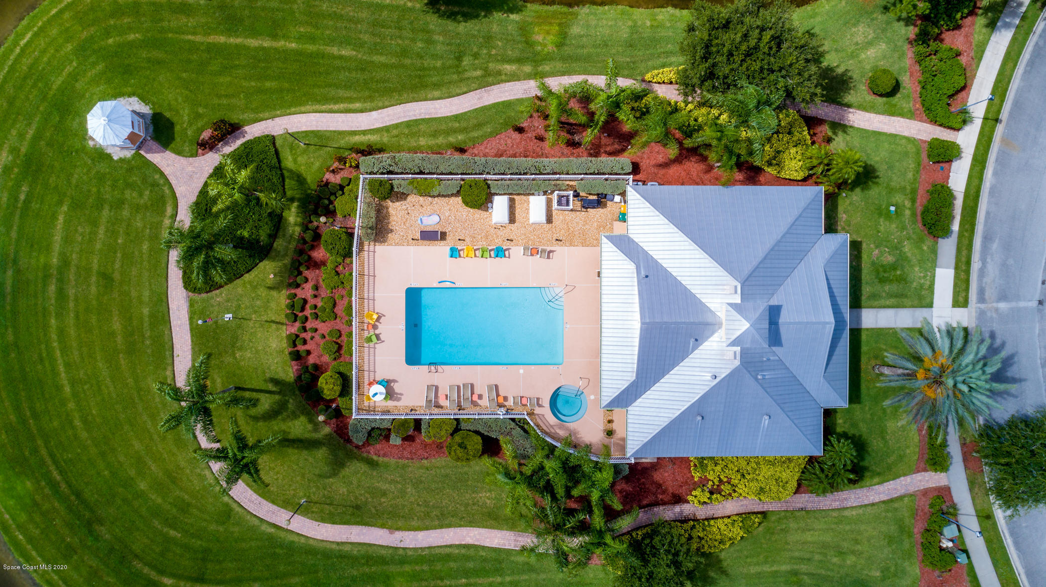4070 Alamanda Key Drive Melbourne, FL 32901 - Photo 26 of 32 an aerial view of a house with a garden and trees
