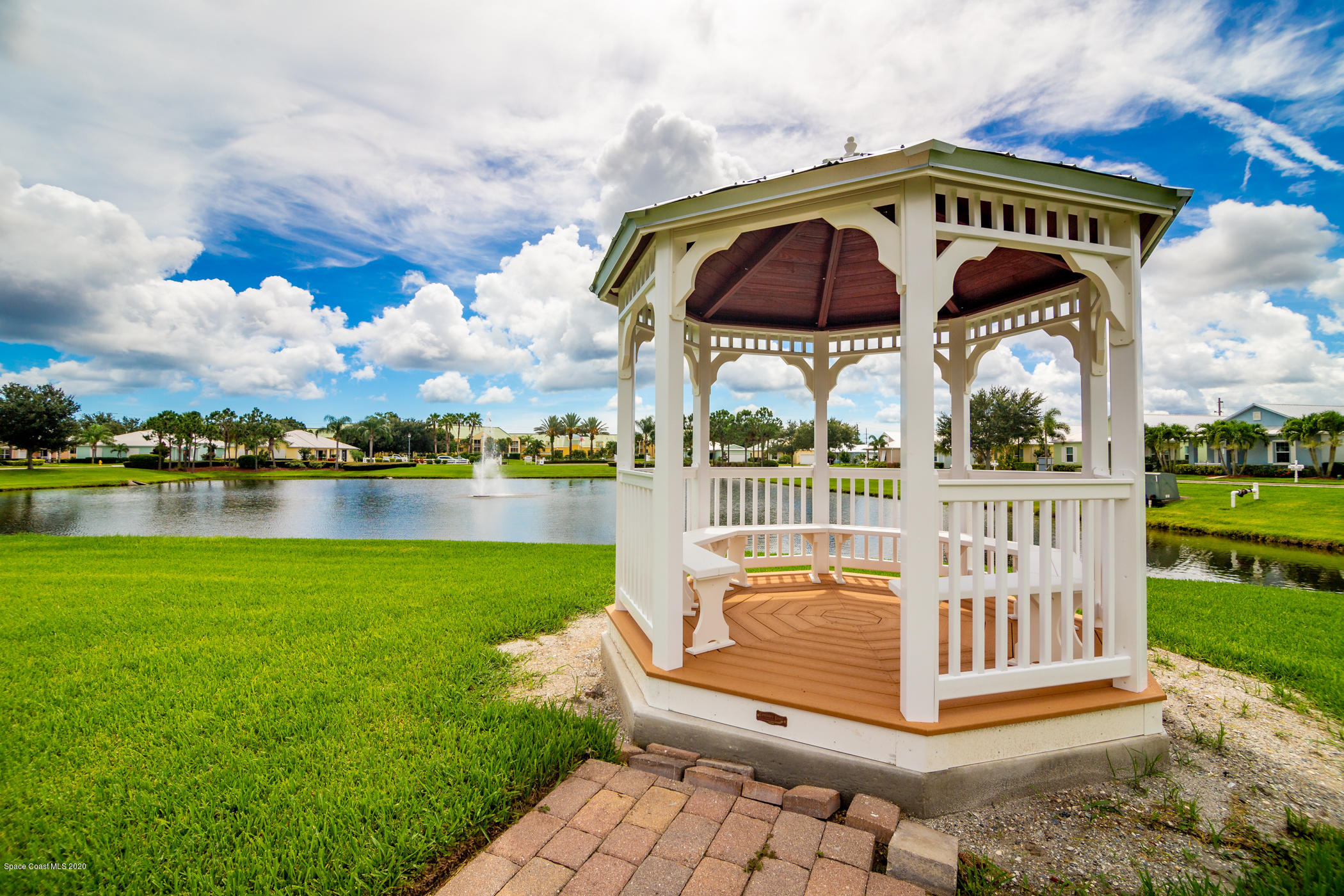 4070 Alamanda Key Drive Melbourne, FL 32901 - Photo 28 of 32 a view of a bench in front of house