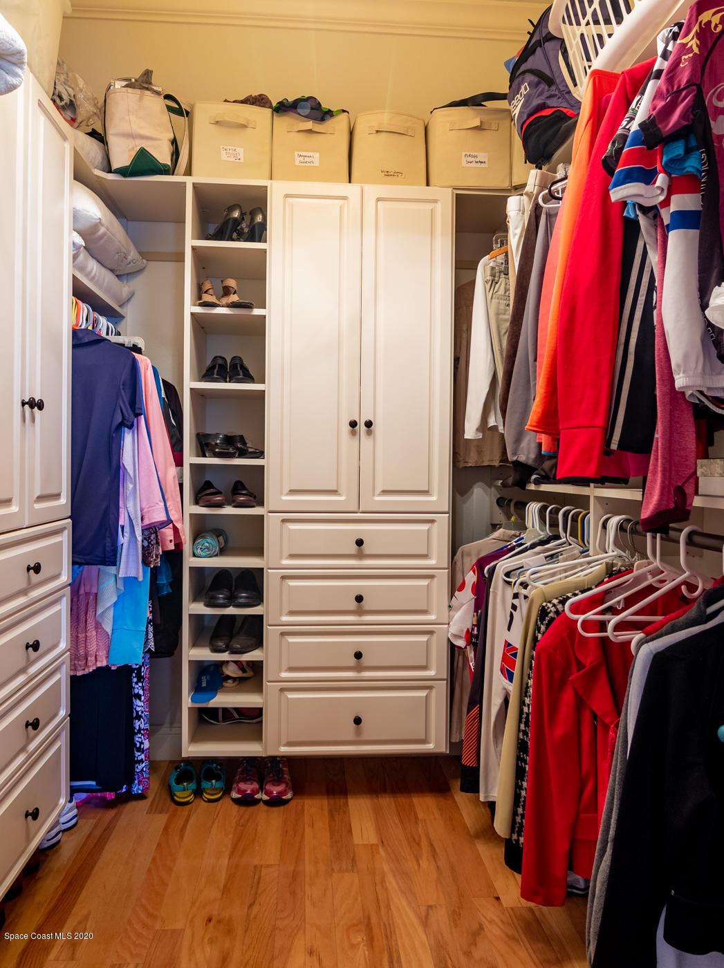 4070 Alamanda Key Drive Melbourne, FL 32901 - Photo 32 of 32 a view of walk in closet with clothes and shoes