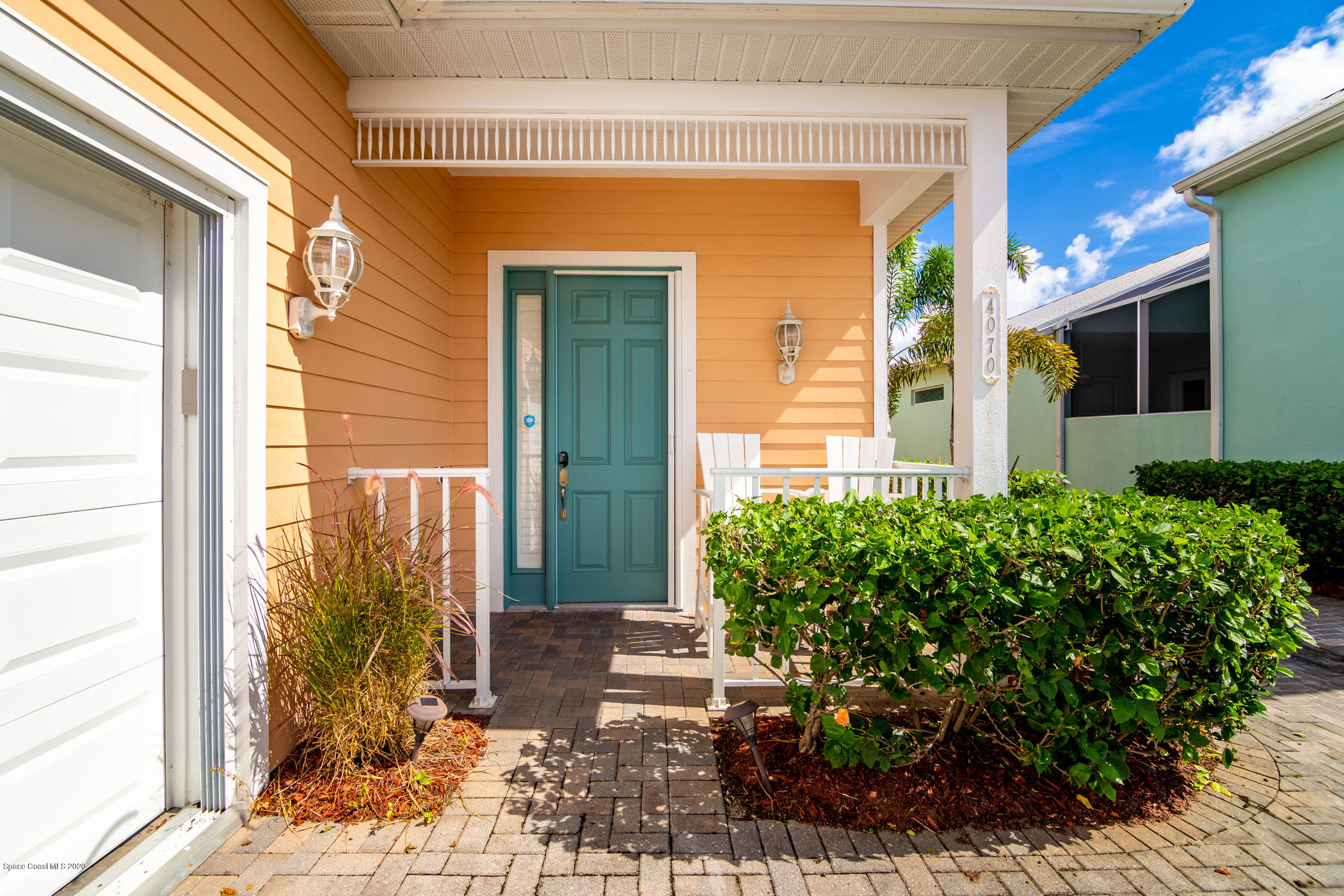 4070 Alamanda Key Drive Melbourne, FL 32901 - Photo 7 of 32 a front view of a house with garden