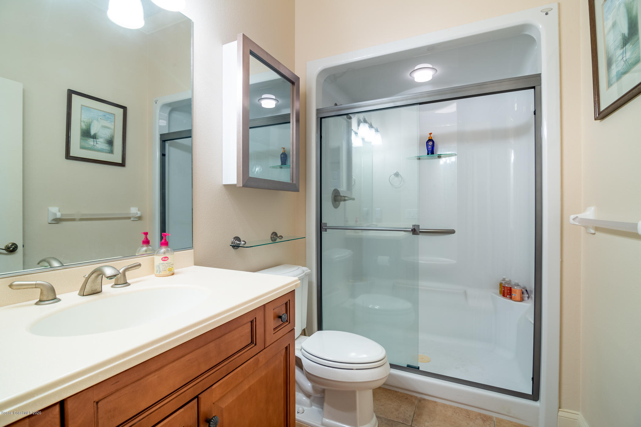 4070 Alamanda Key Drive Melbourne, FL 32901 - Photo 9 of 32 a bathroom with a sink toilet and shower