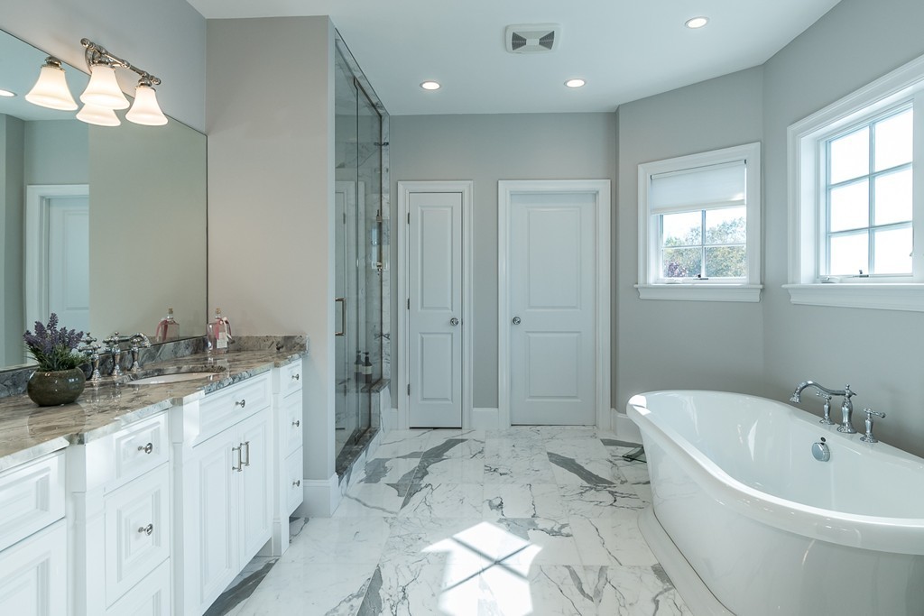 44 Peregrine Road Newton, MA 02459 - Photo 12 of 25 a spacious bathroom with a bathtub sink and mirror