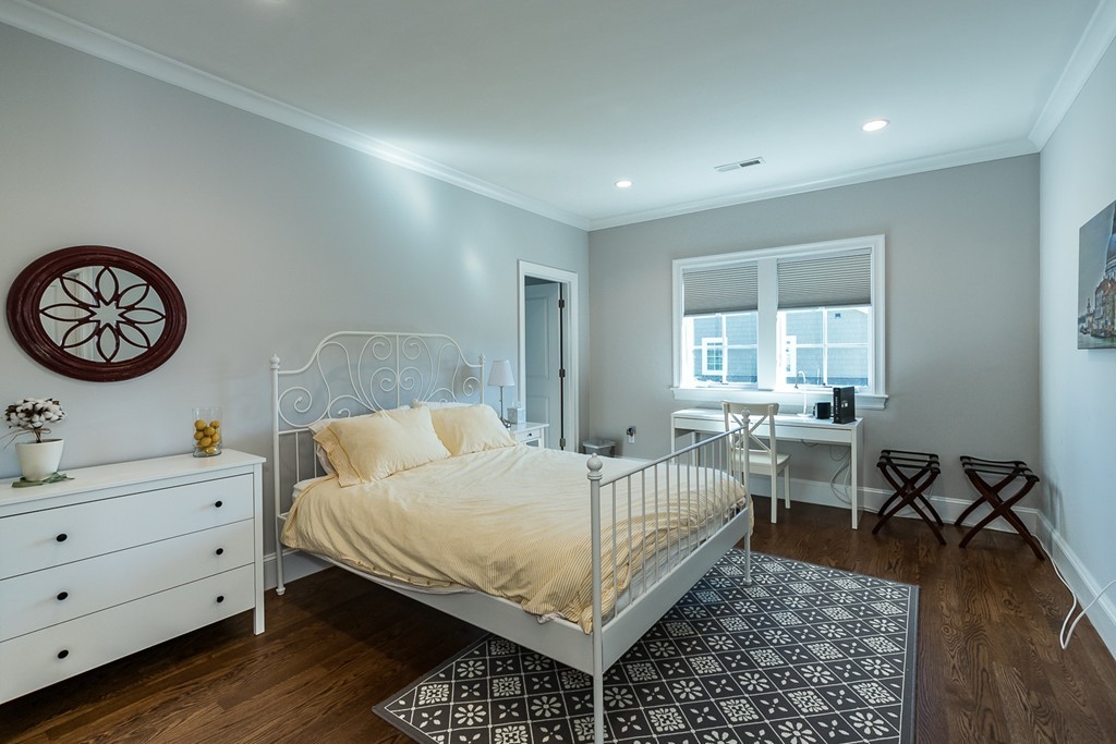 44 Peregrine Road Newton, MA 02459 - Photo 15 of 25 a bedroom with a bed and a dresser in it